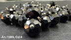 Collection of black glass buttons for sewing featuring a faceted design and shiny finish
