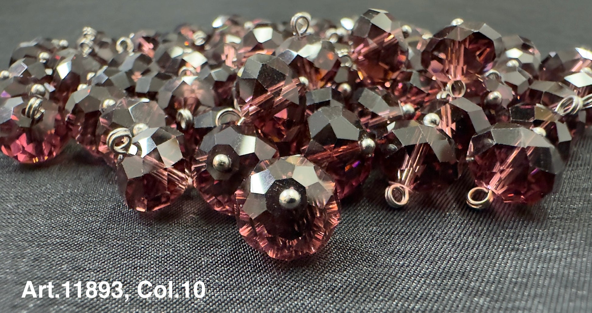 Glass buttons for sewing in a rich purple color with faceted design from Buttonology Inc.