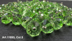 Lot of green glass buttons for sewing with a faceted design and metal loops for attachment