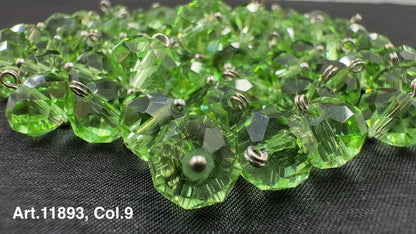 Lot of green glass buttons for sewing with a faceted design and metal loops for attachment