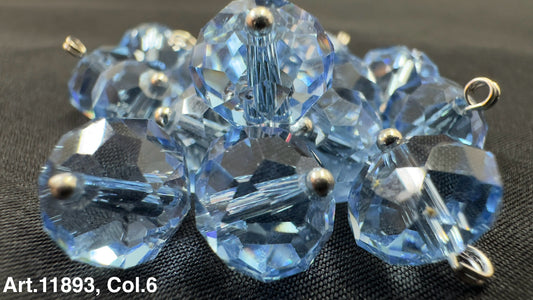 Assorted blue glass buttons for sewing arranged together with shiny facets and metal shanks