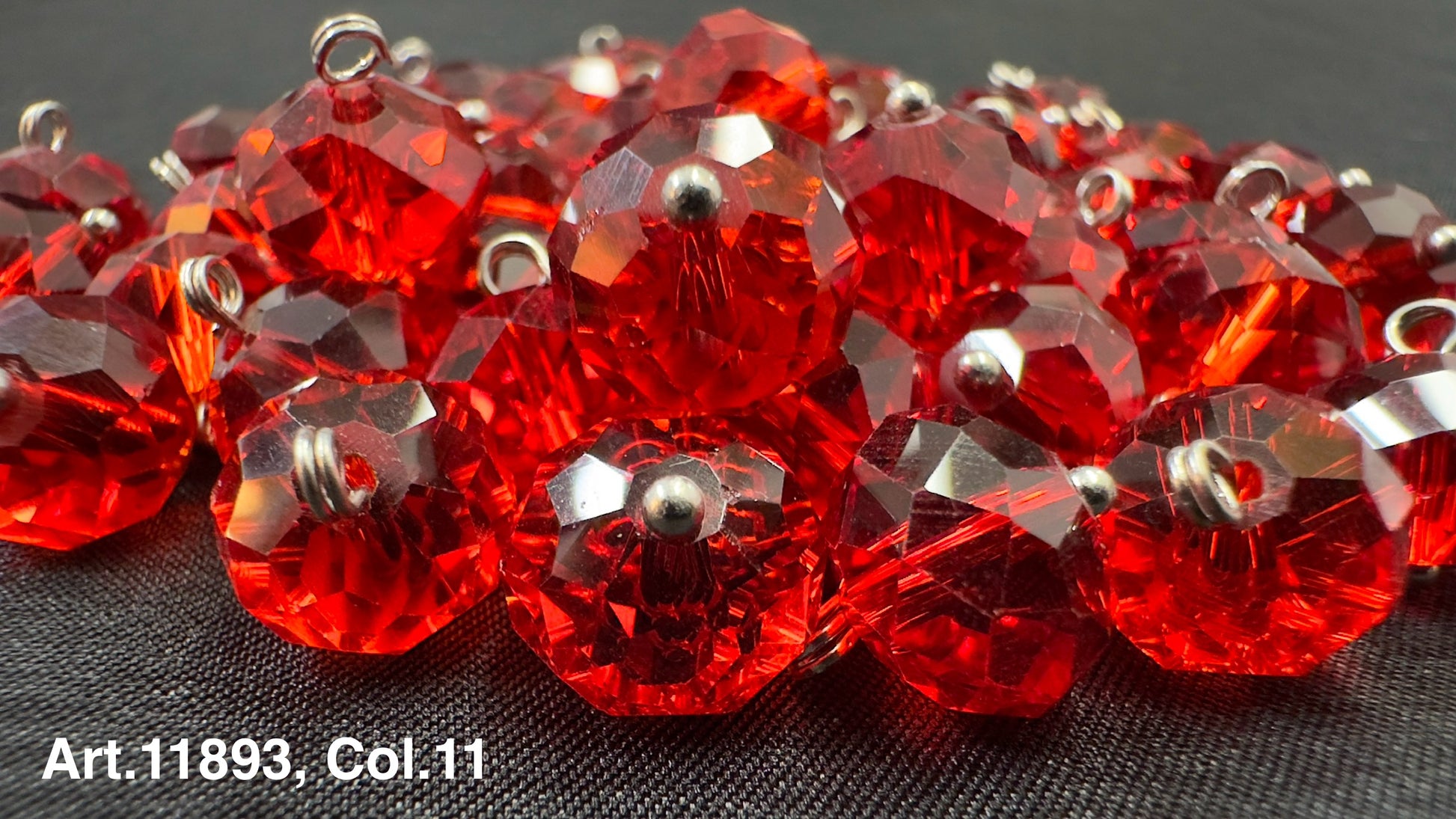 Red glass buttons for sewing with a faceted design, perfect for crafting and embellishments