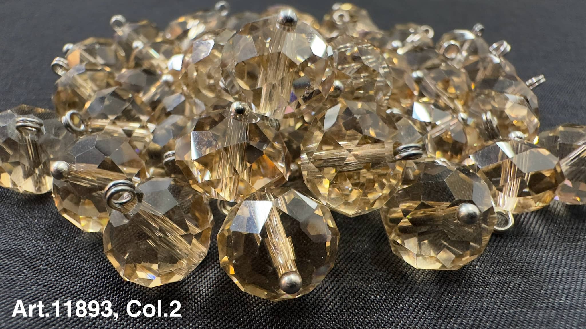 Collection of glass buttons for sewing in various sizes and shapes with a sparkling finish