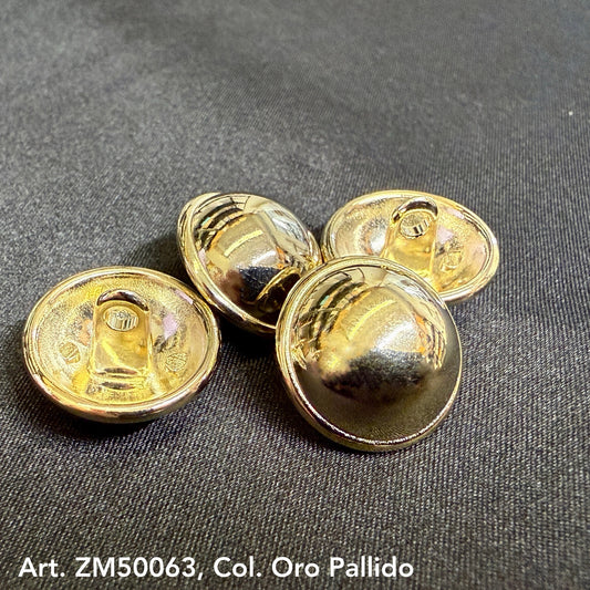 Gold metal shank buttons with shiny reflective surface from Buttonology Inc on black fabric