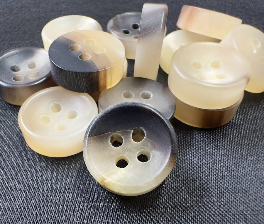 Horn, bone, wood and corozo buttons, close-up