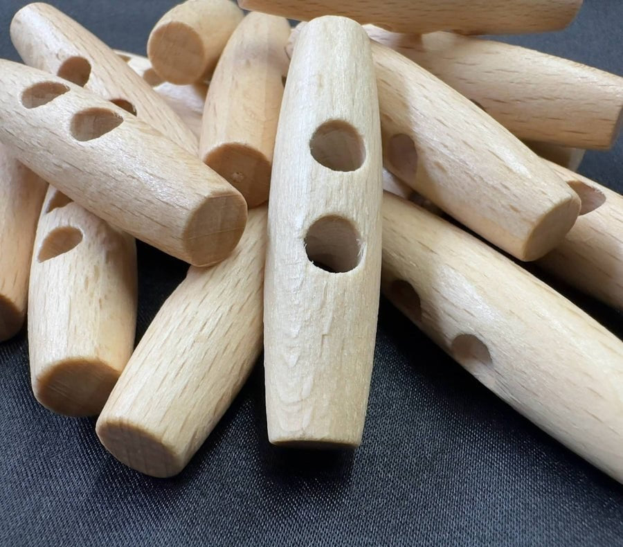 Wood, horn and resin toggles and slides