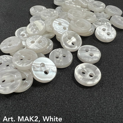 Buttonology Inc white pearlescent 2-hole plastic buttons for DIY projects on dark fabric