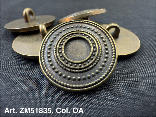 Antique metal buttons for clothing by Buttonology Inc with intricate circular dotted design