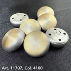 Set of metal dome buttons for coats with textured silver finish on dark fabric background