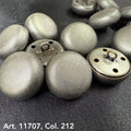 Metal dome buttons for coats with textured silver finish from Buttonology Inc close-up on dark fabric