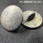 Buttonology Inc metal shank buttons with textured round design on dark fabric background