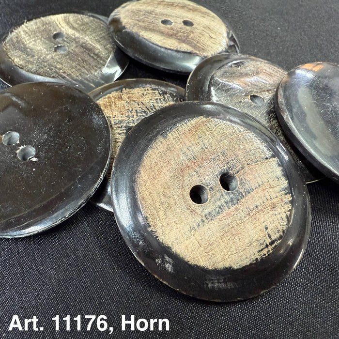 Buttonology Inc horn buttons for garments featuring round two-hole design with natural wood texture