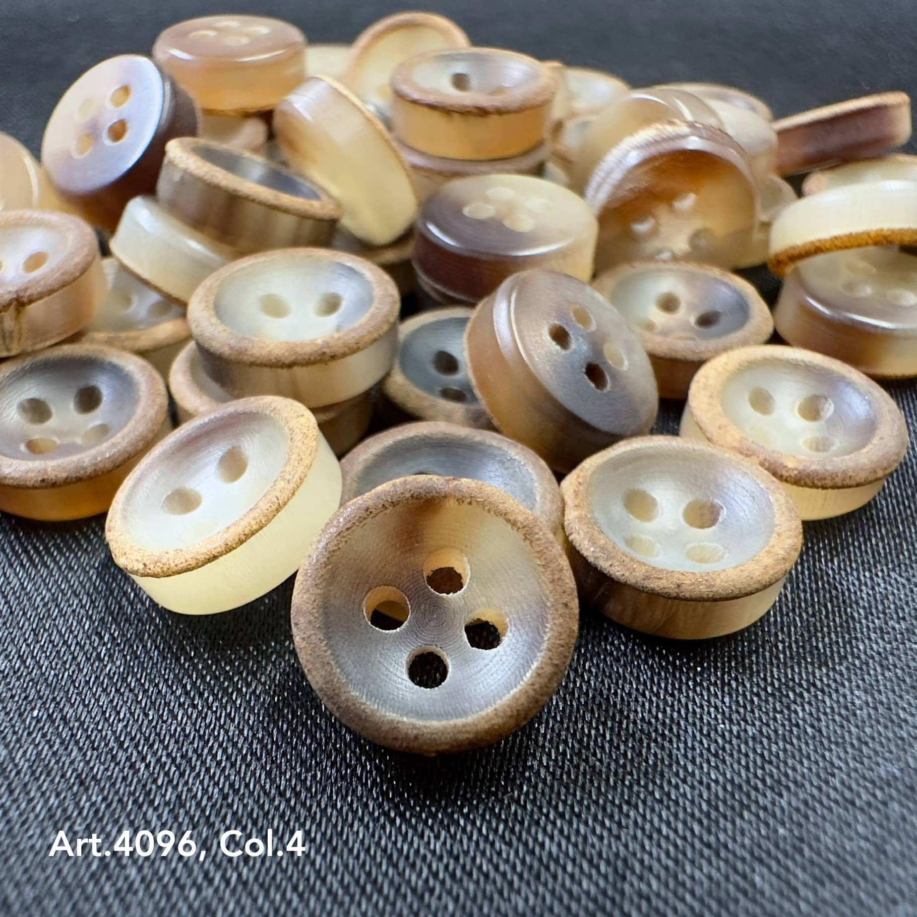 Natural Real horn buttons with varying shades of beige and brown from Buttonology Inc