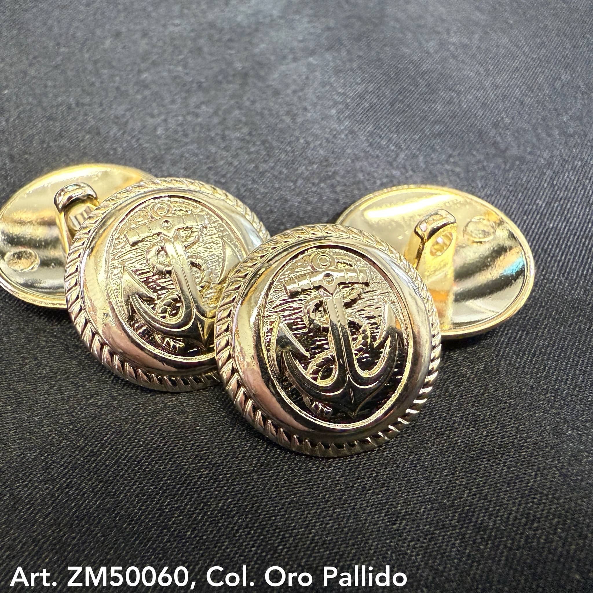 Nautical gold buttons with anchor design by Buttonology Inc on black fabric background