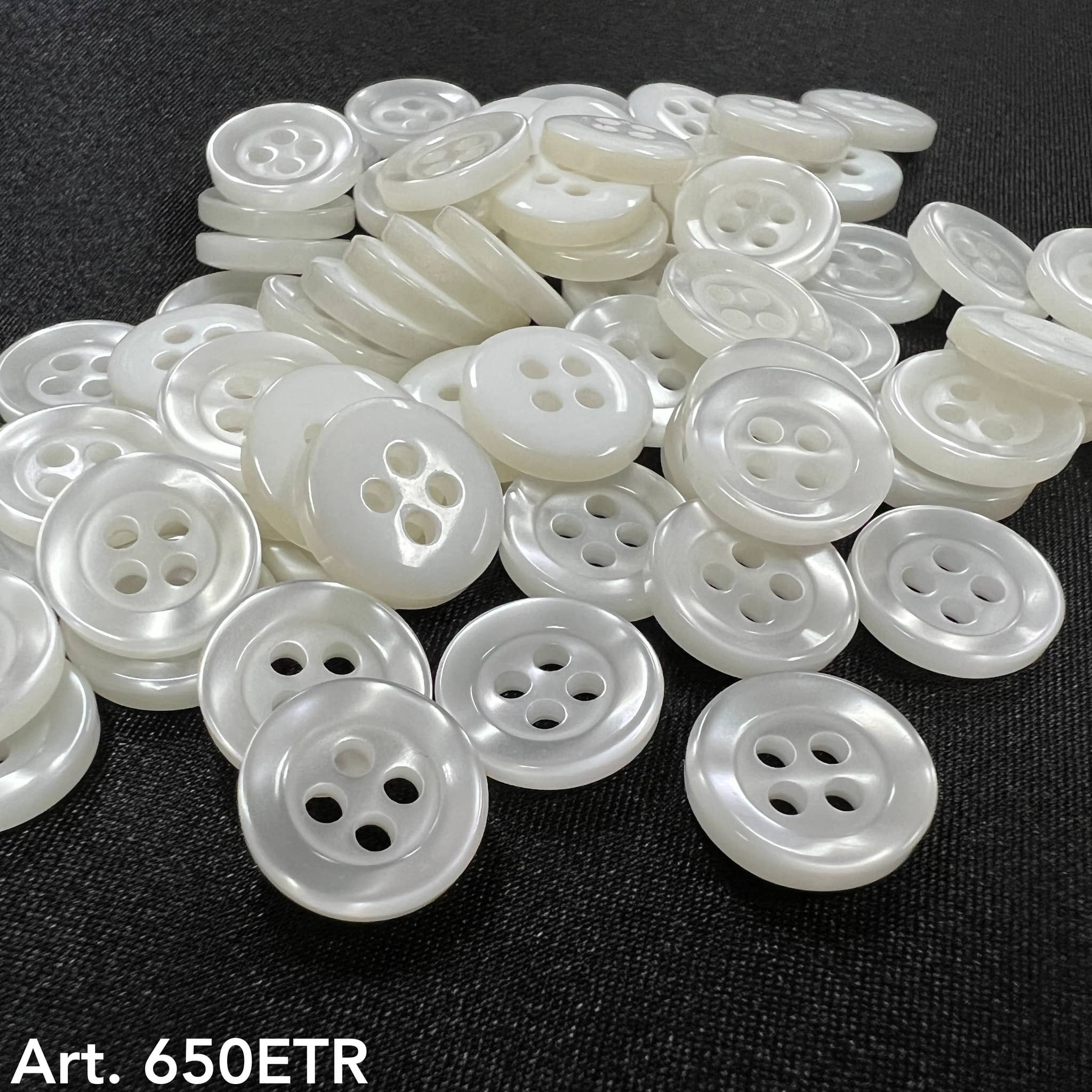 Pearl white 4-hole buttons in various sizes for sewing and crafting projects