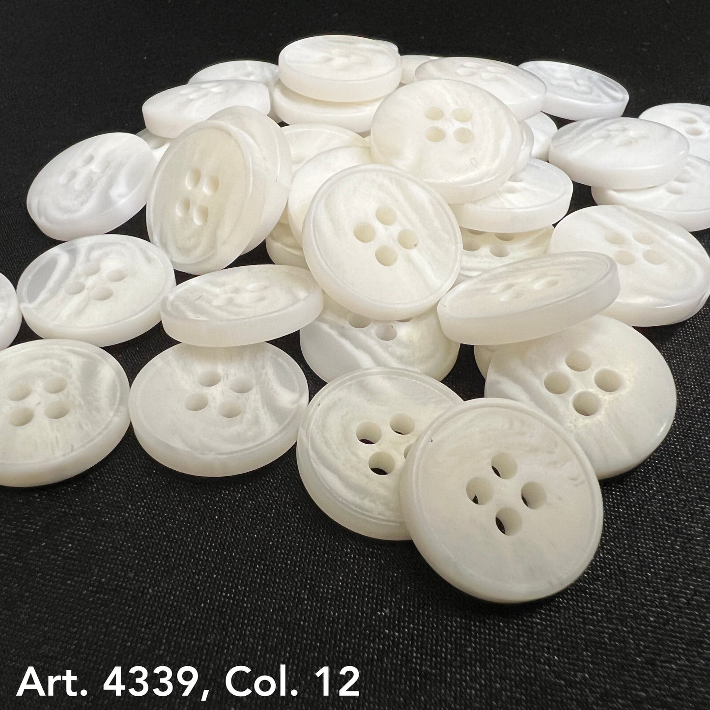 White plastic buttons sewing buttons with four holes by Buttonology Inc for crafts and apparel