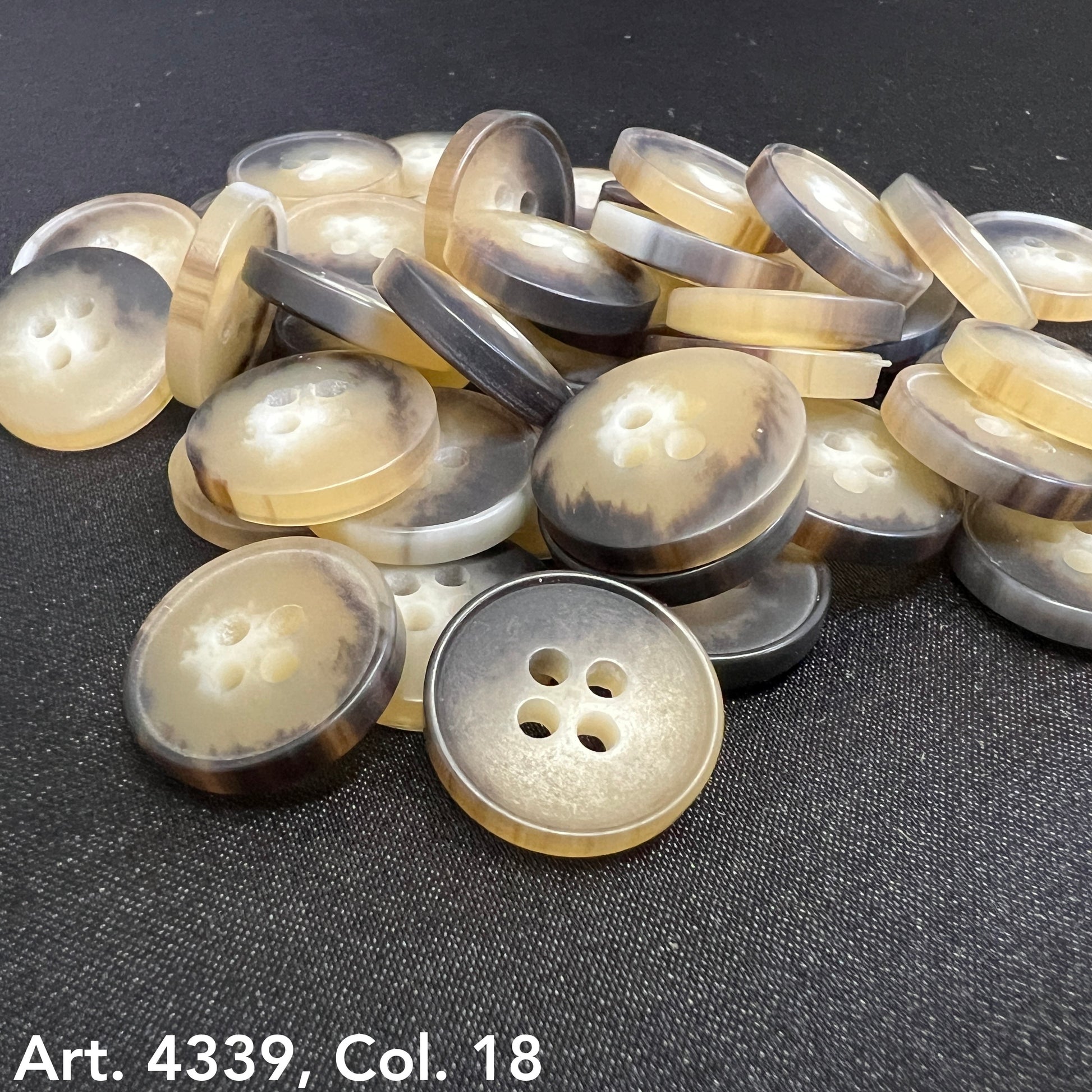 Plastic buttons sewing buttons in beige and brown tones with four holes from Buttonology Inc
