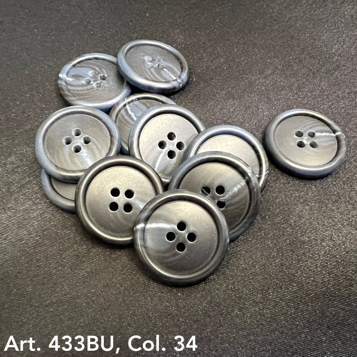 Premium 4-hole sewing buttons in black with a glossy finish for versatile crafting and tailoring projects