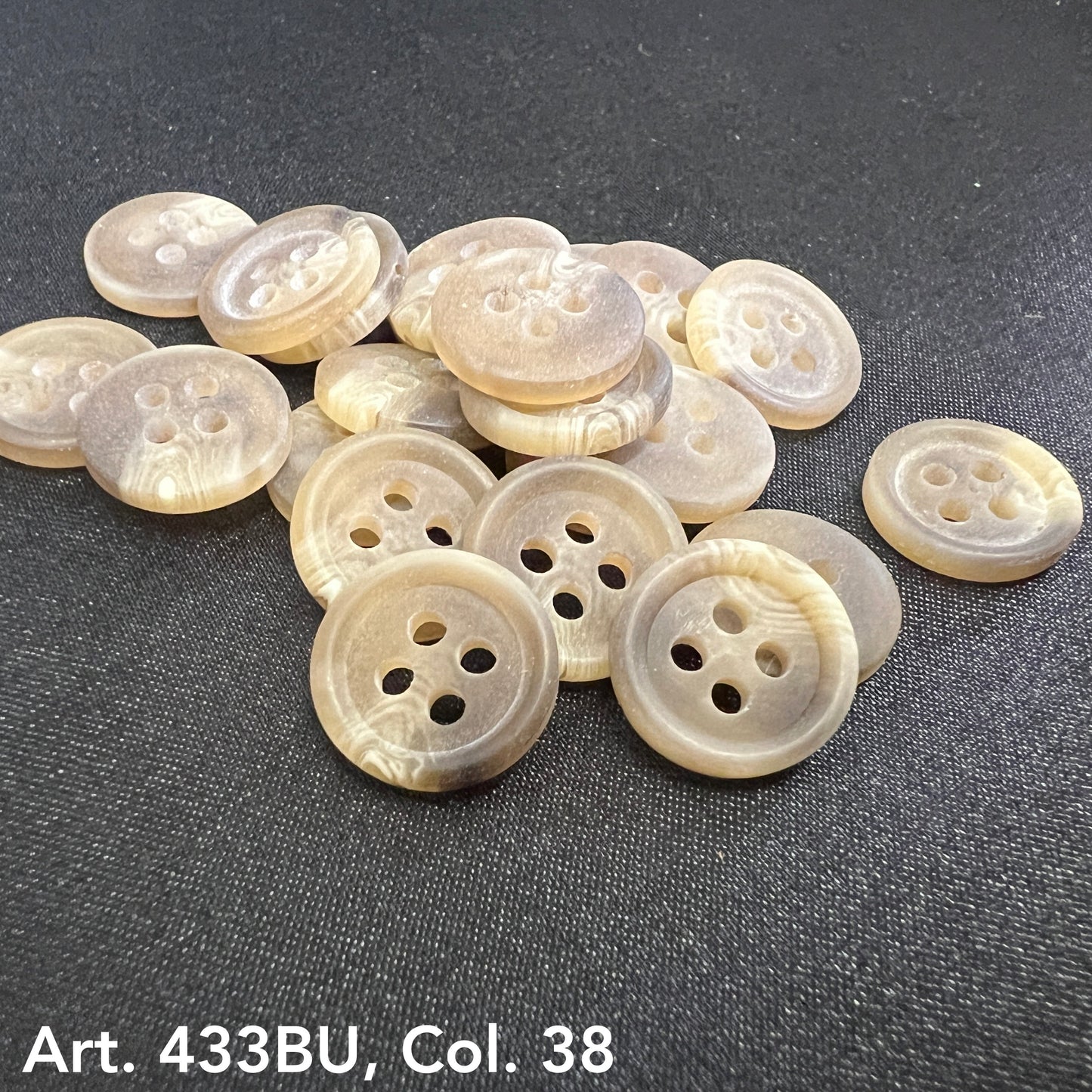 Premium 4-hole sewing buttons in a light beige color, perfect for crafts and clothing projects