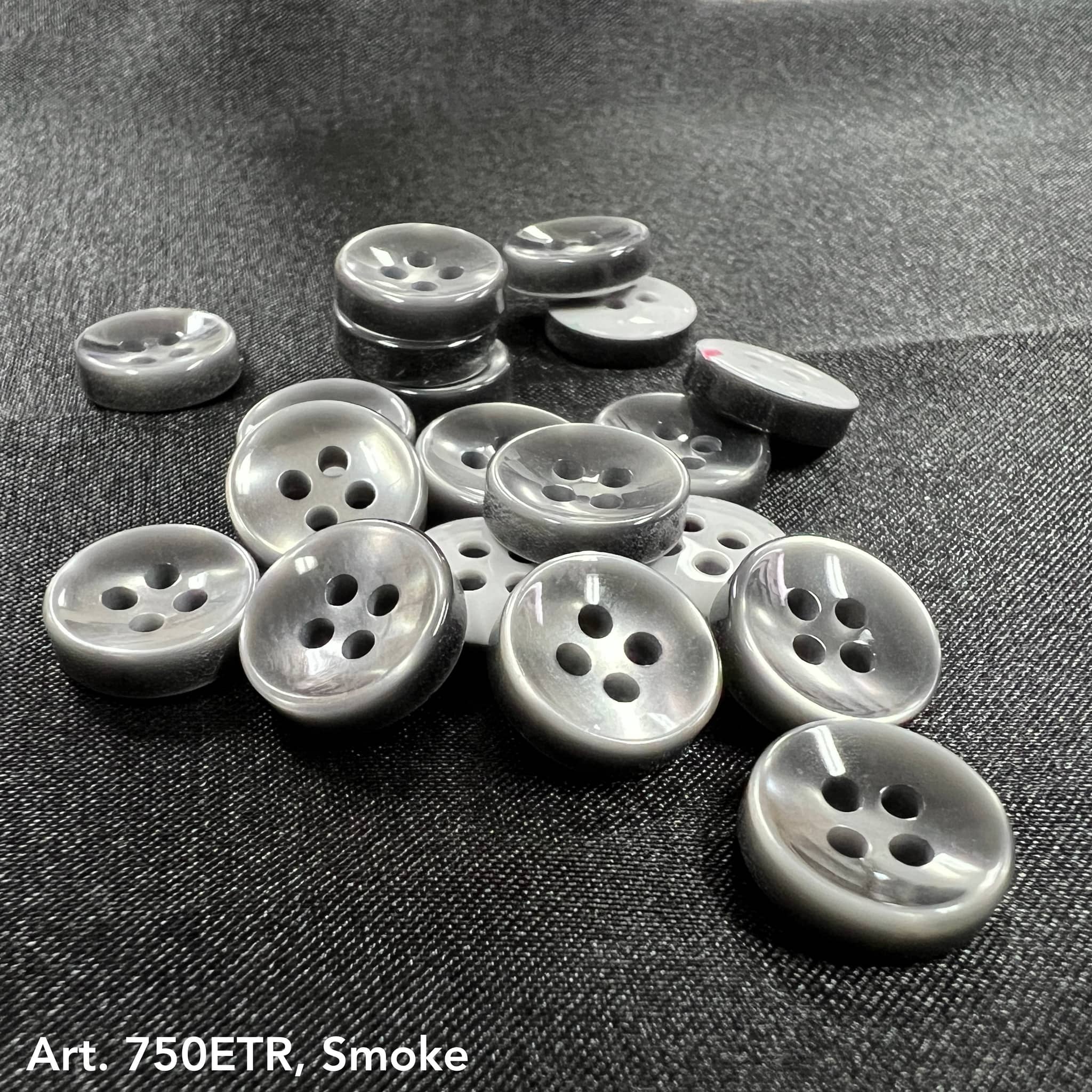 Premium garment buttons for shirts in smoke gray with four holes, ideal for stylish apparel