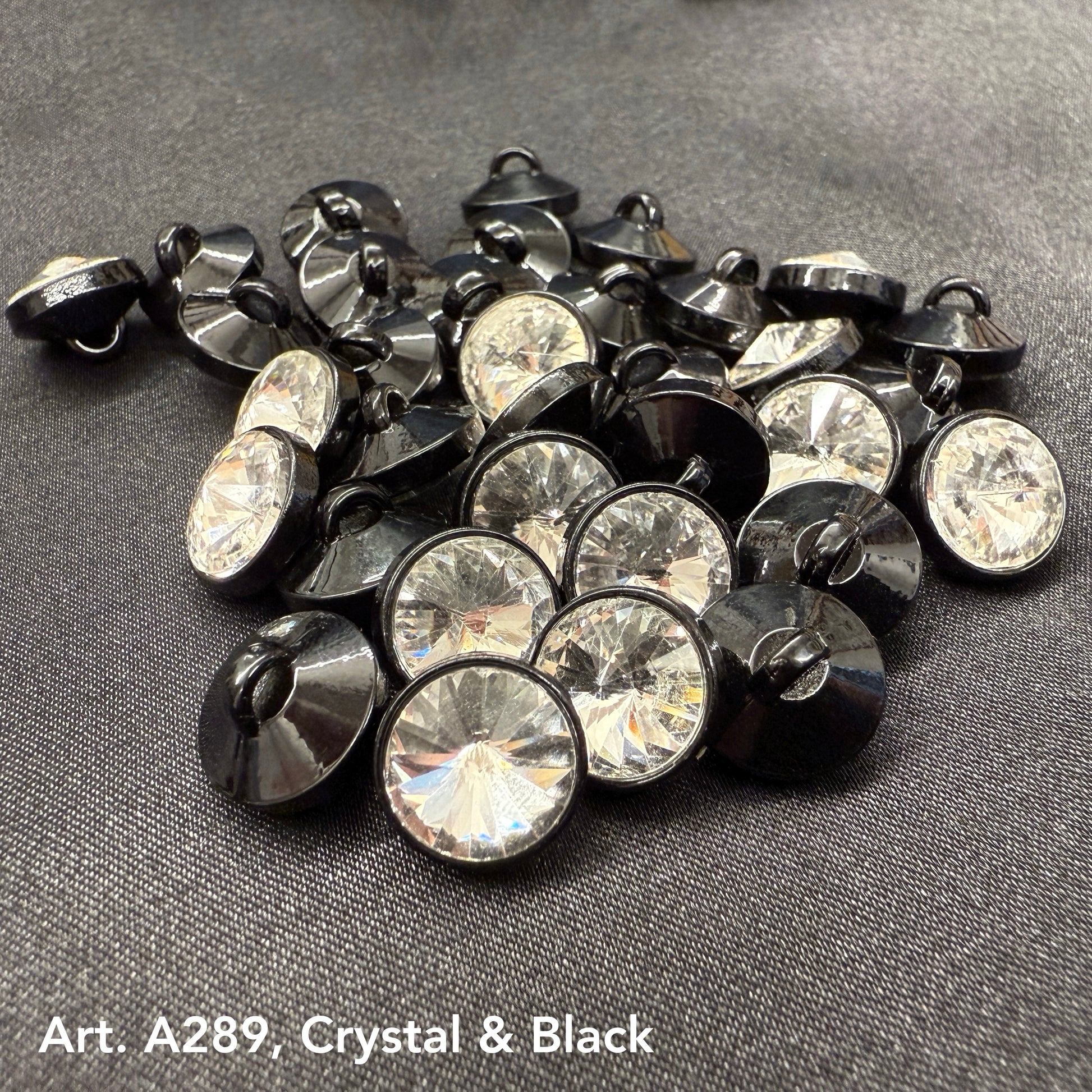 Assorted premium rhinestone buttons for dresses in crystal and black finish by Buttonology Inc