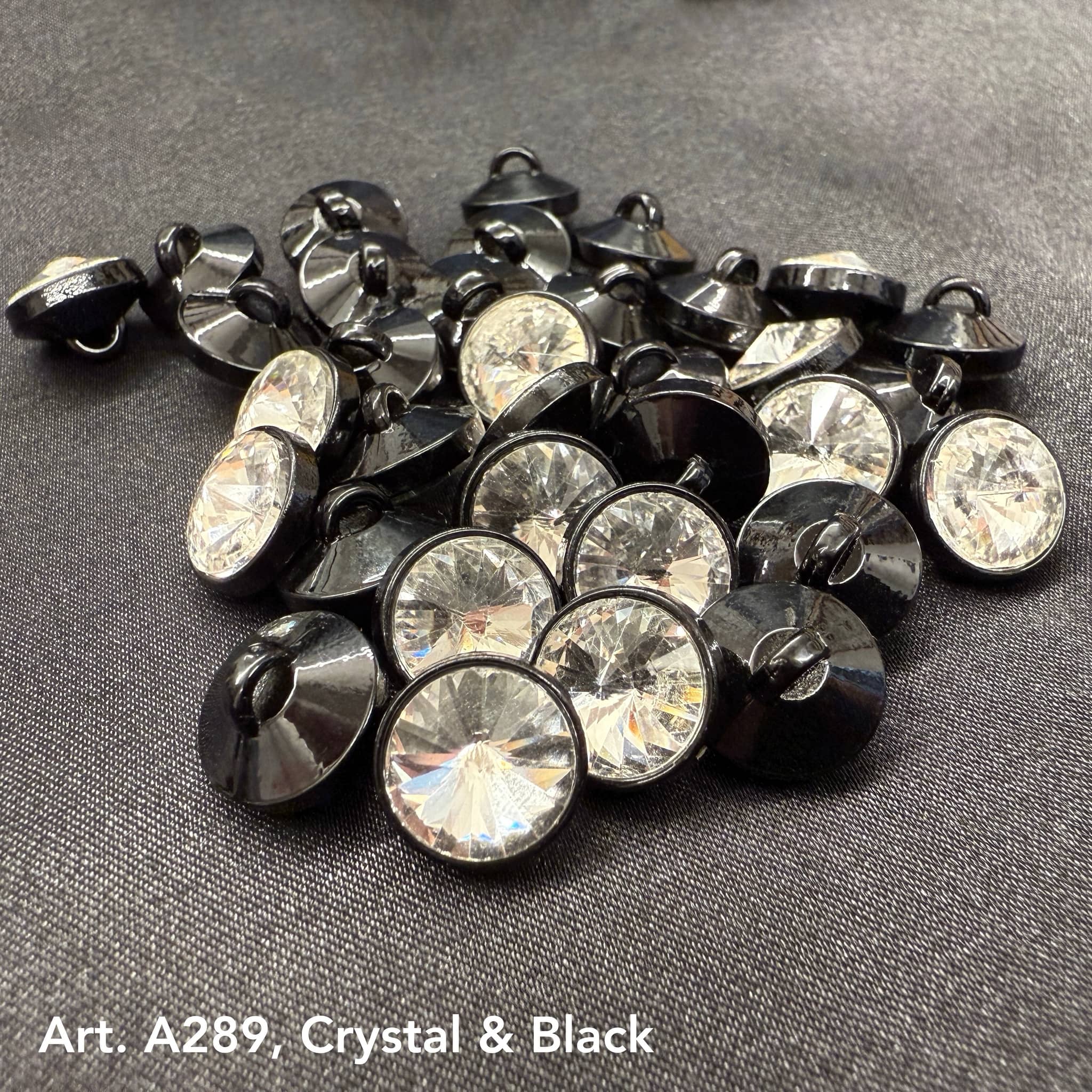 Assorted premium rhinestone buttons for dresses in crystal and black finish by Buttonology Inc