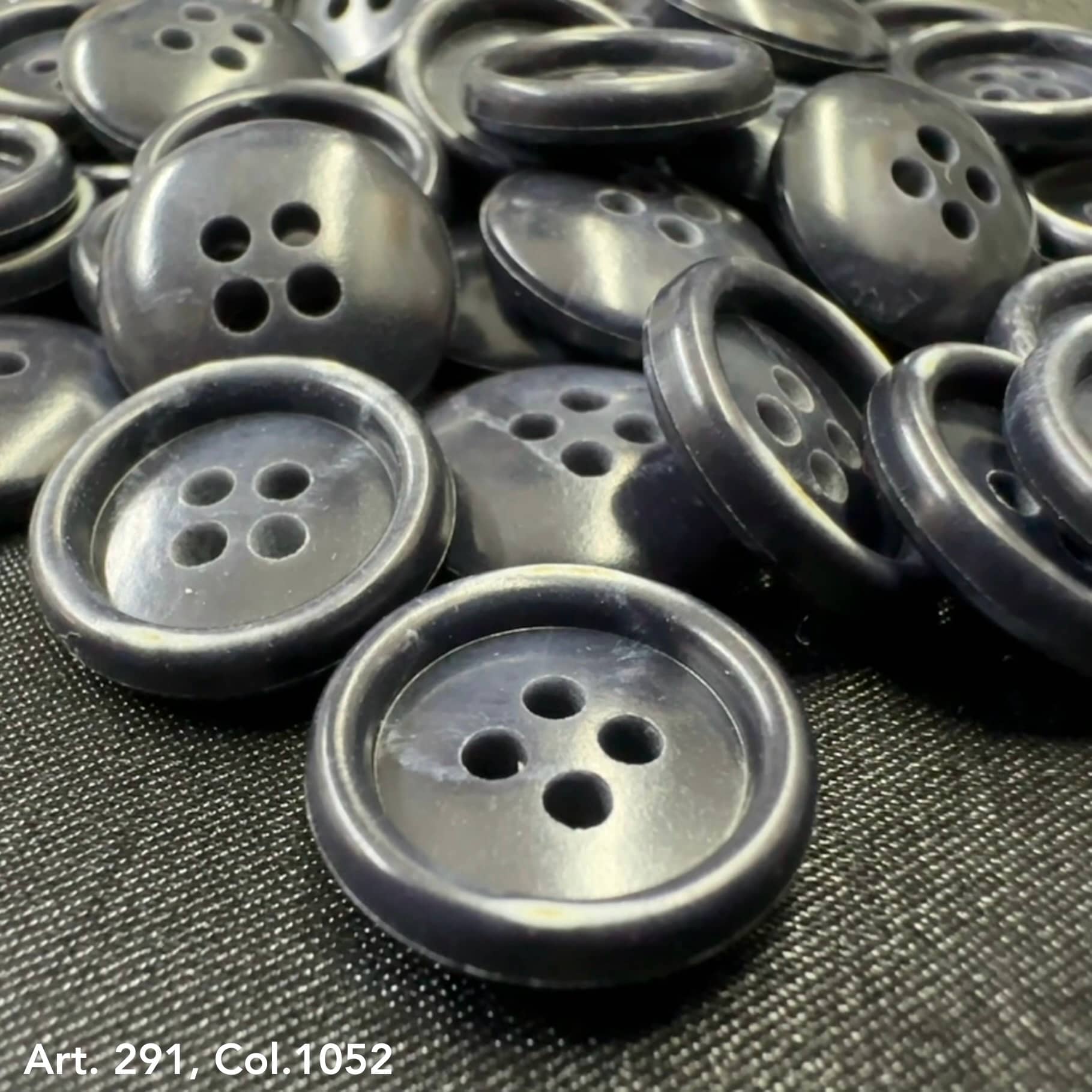 Collection of premium sewing buttons for clothes in dark navy color with four holes