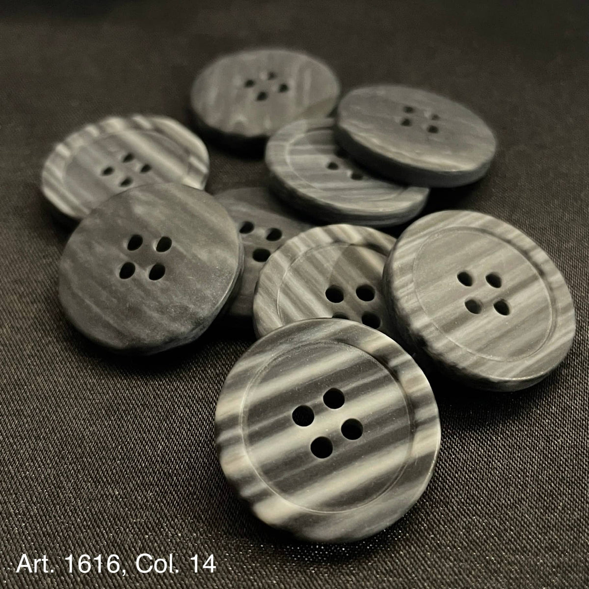 Premium sewing buttons for clothing in gray marbled design, perfect for elegant garment details