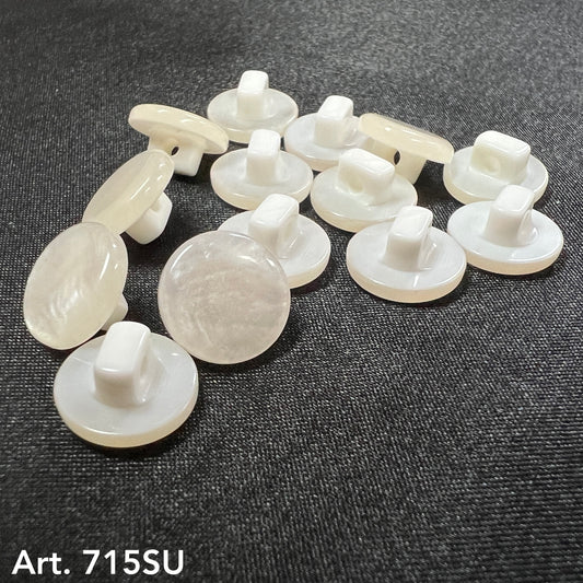 Premium sewing buttons by Buttonology Inc made from glossy white material for elegant garment finishing