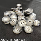 Buttonology Inc premium suit buttons in shiny gray four-hole design on black fabric