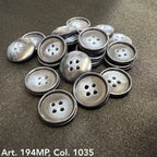 Premium suit buttons by Buttonology Inc in a glossy dark finish, arranged on a black fabric background