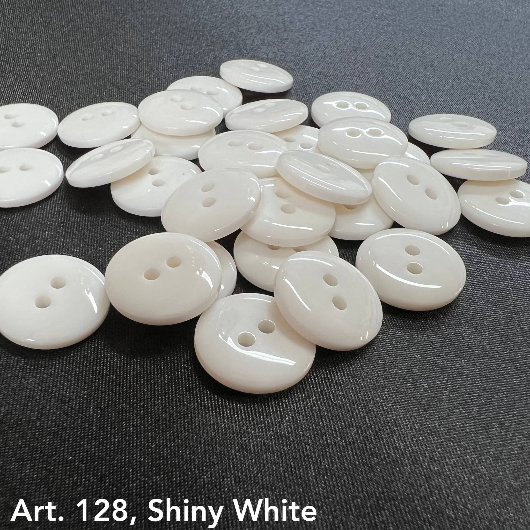Art. 128 shiny white polyester 2-hole sewing buttons, sizes 14L–80L – Buttonology Inc.