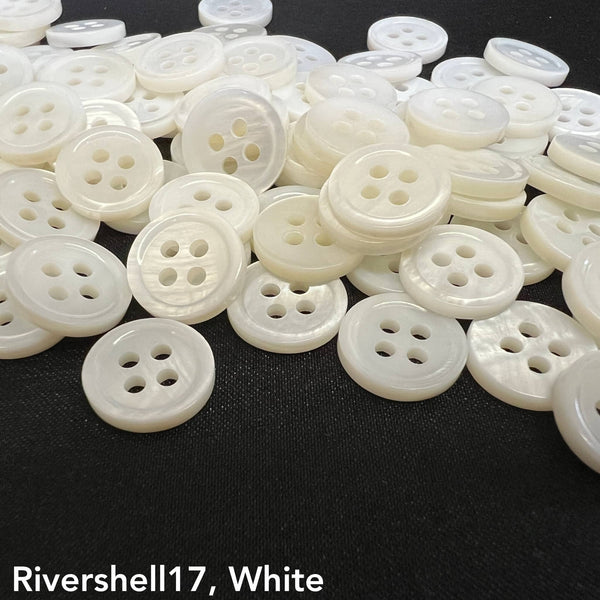 Rivershell buttons for clothing by Buttonology Inc in white with four-hole design on black background