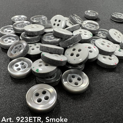 Assorted sew-on buttons for clothing in smoke color, featuring a shiny finish and two holes