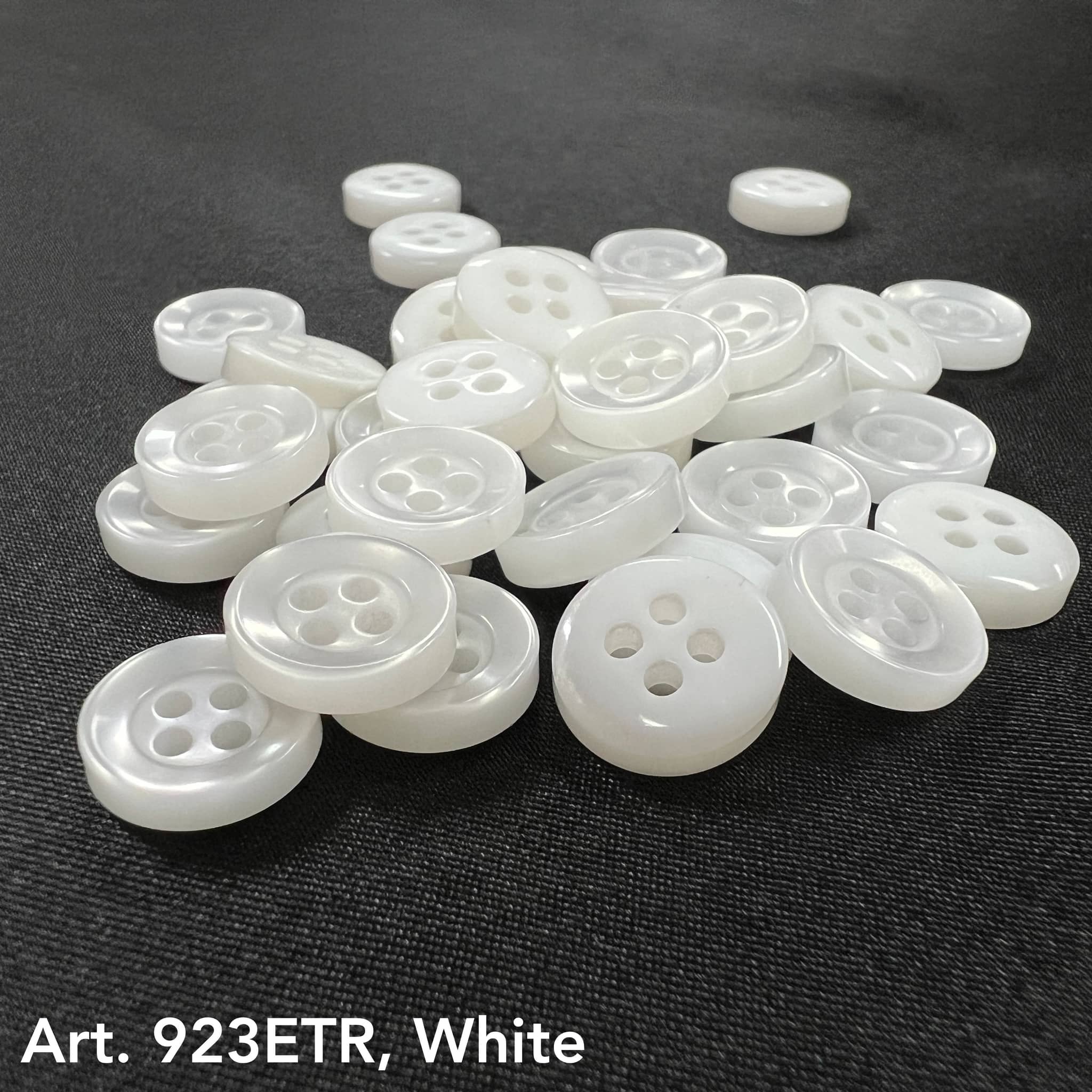 White sew-on buttons for clothing, featuring four holes for secure fastening and stylish design