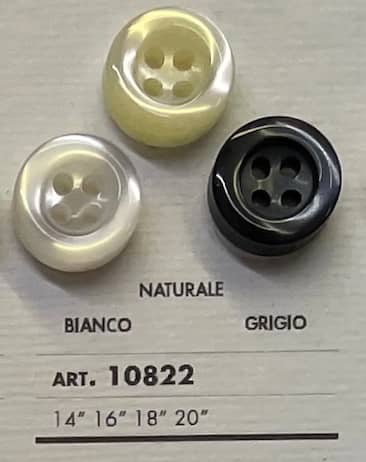 Buttonology Inc sewing accessory buttons in white, cream, and black with four holes for sewing projects
