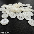 A collection of white sewing buttons with four holes for crafting and garment repairs