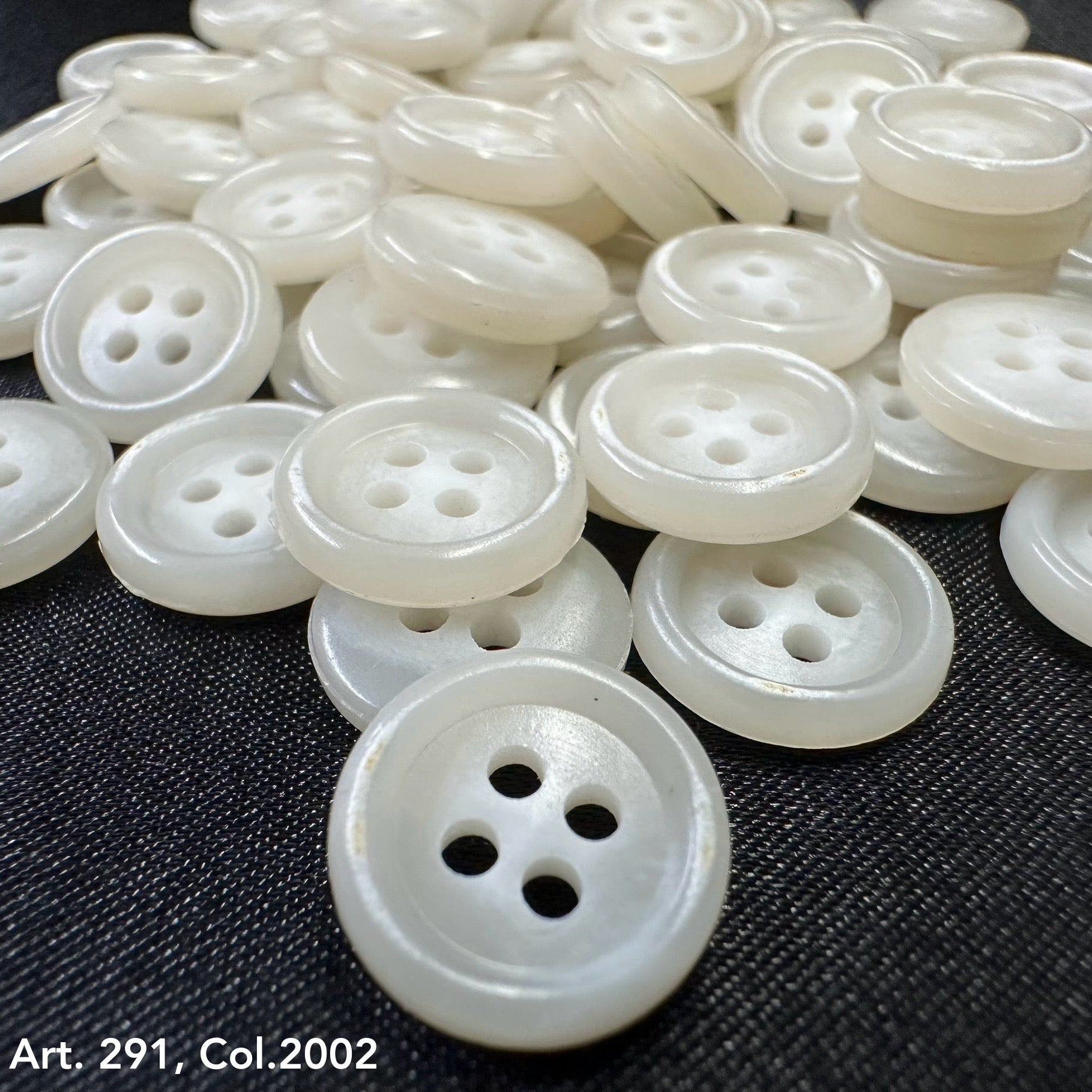 Assortment of Buttonology Inc. white shirting buttons 18L 20L with four holes for sewing projects