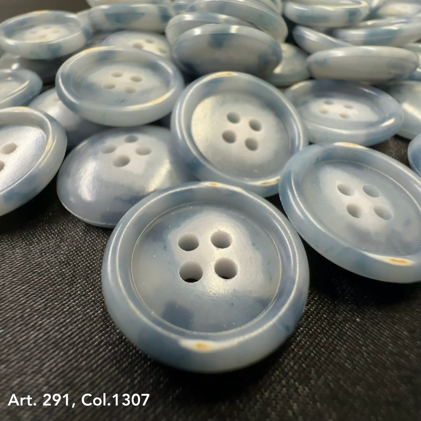 Blue marble shirting buttons 18L 20L from Buttonology Inc with four holes for sewing projects
