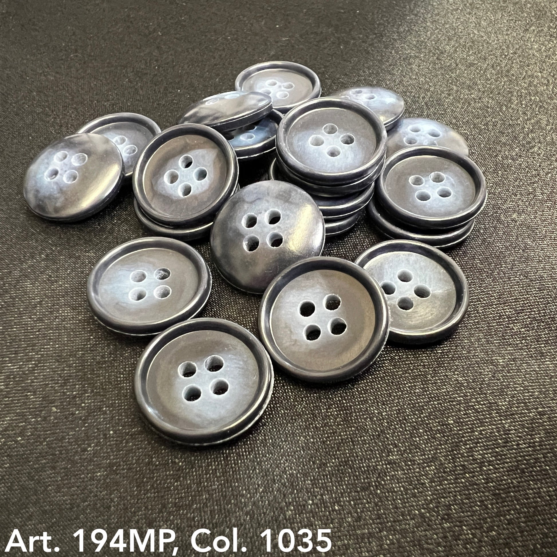 Collection of Buttonology Inc. shirting buttons for dress shirts in various shades of gray