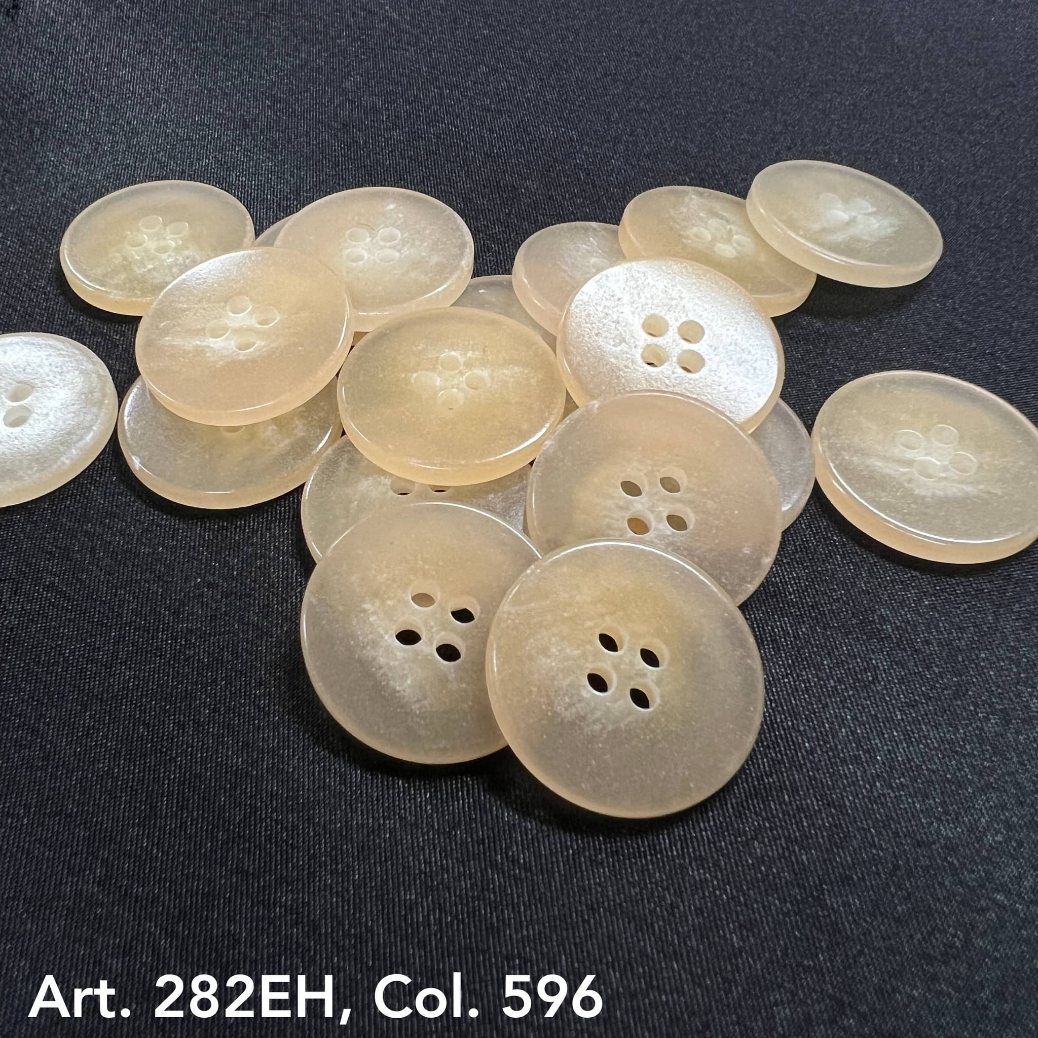 Art. 282EH Col. 596 clear translucent faux-horn 4-hole buttons, 24L–44L – Buttonology Inc.