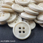 Natural cream suiting buttons for garments with four holes for easy sewing and secure attachment
