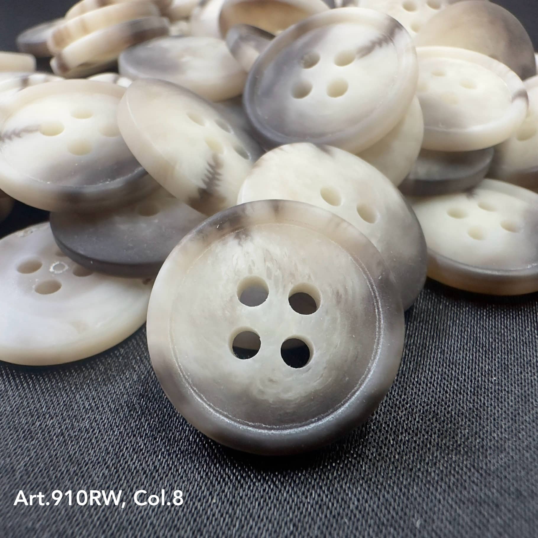 Assorted suiting buttons for garments in various shades with four holes for easy sewing