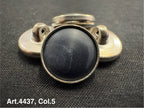 Buttonology Inc black Urea shank buttons with metal backing on textured fabric background