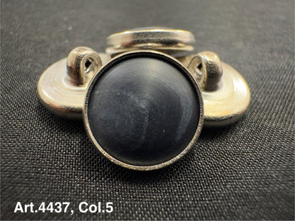 Buttonology Inc black Urea shank buttons with metal backing on textured fabric background