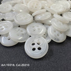 Buttonology Inc white high-quality shirt buttons with four holes stacked on black fabric