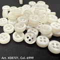 Variety of white round sewing buttons from Buttonology Inc. featuring four holes for versatile use.