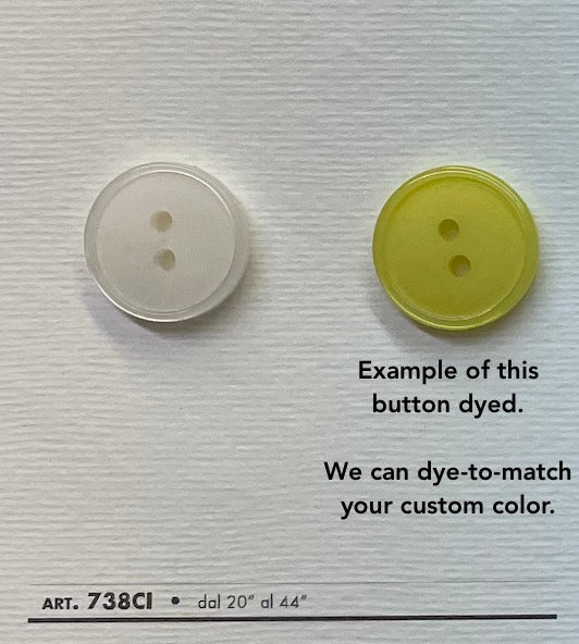 Two white two hole sewing buttons displayed with a dyed example for custom color matching