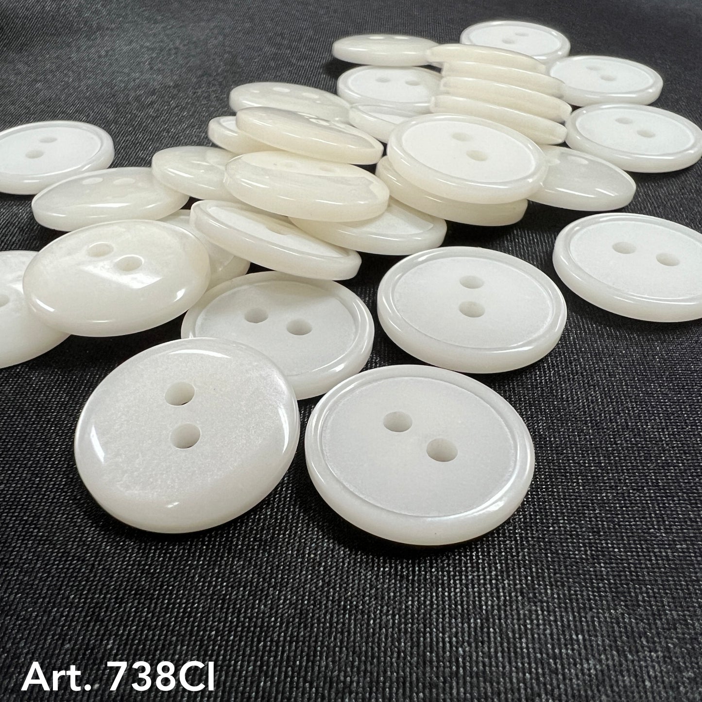 White two hole sewing buttons from Buttonology Inc in various sizes for crafting and garment repair