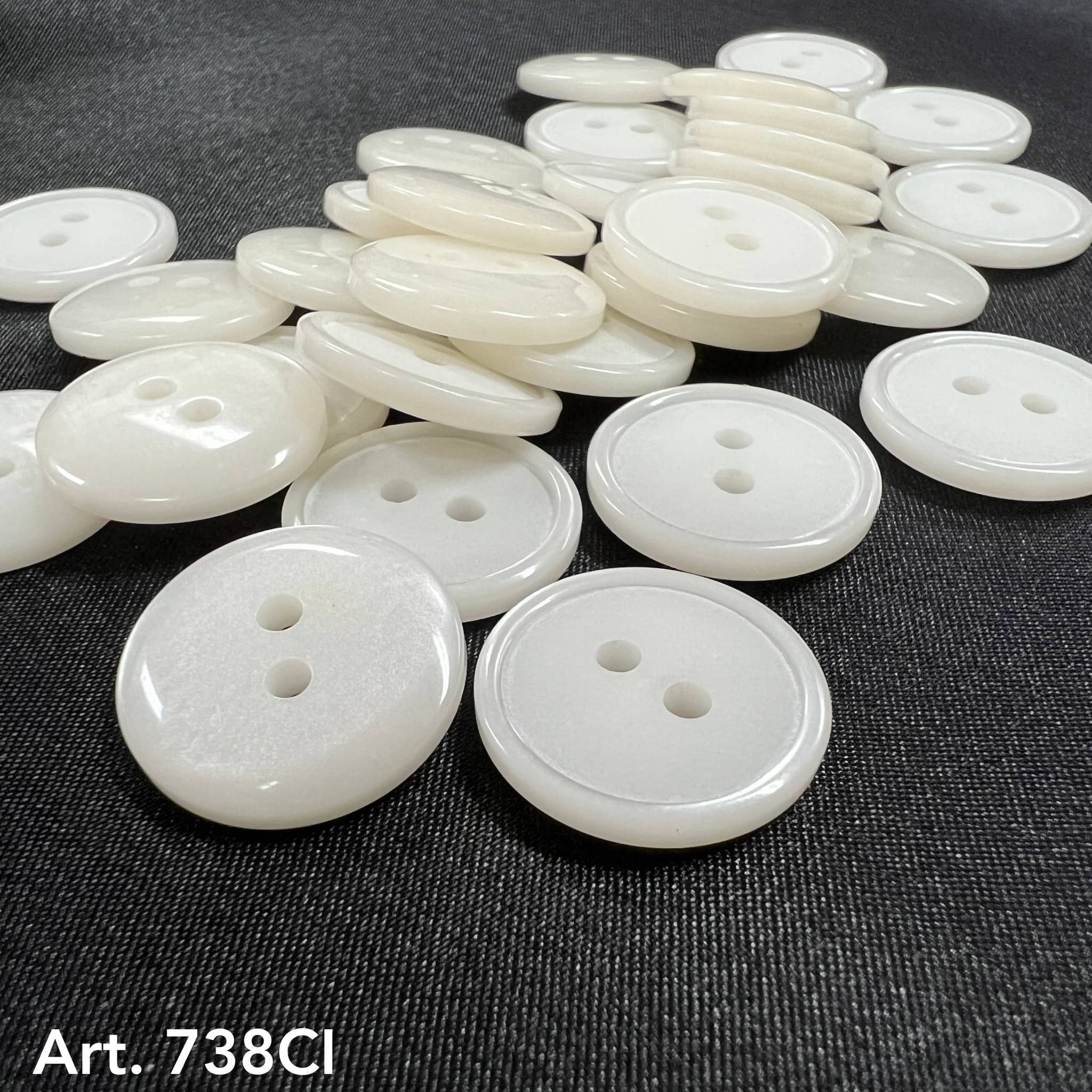 White two hole sewing buttons from Buttonology Inc in various sizes for crafting and garment repair